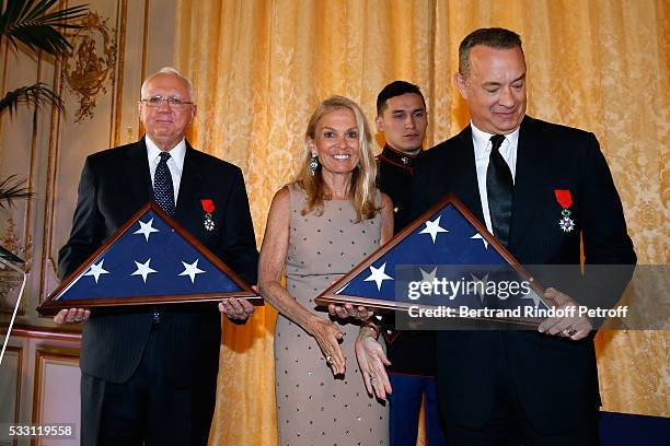 Doctor Gordon "Nick" Mueller, Ambassador of USA in France, Jane D. Hartley and Actor Tom Hanks attend the Flag Ceremony after Tom Hanks, Tom Brokaw &...