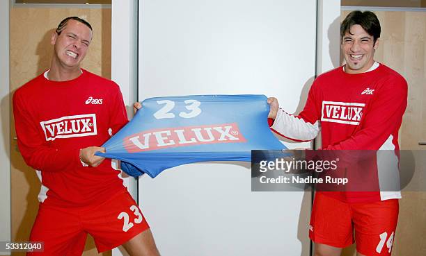 Pascal Hens and Bertrand Gille test the material of their new jerseys during the HSV Handball Team presentation and the press conference on August 1,...