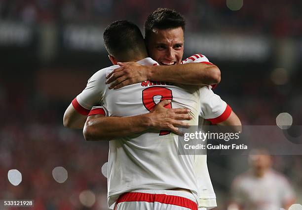 Benfica's forward from Mexico Raul Jimenez celebrates with teammate SL Benfica's midfielder from Greece Andreas Samaris after scoring a goal during...