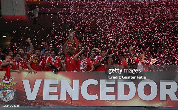 Benfica's defender from Brazil Luisao and teammates celebrate with trophy after winning the Portuguese League Cup Title at the end of the Taca CTT...