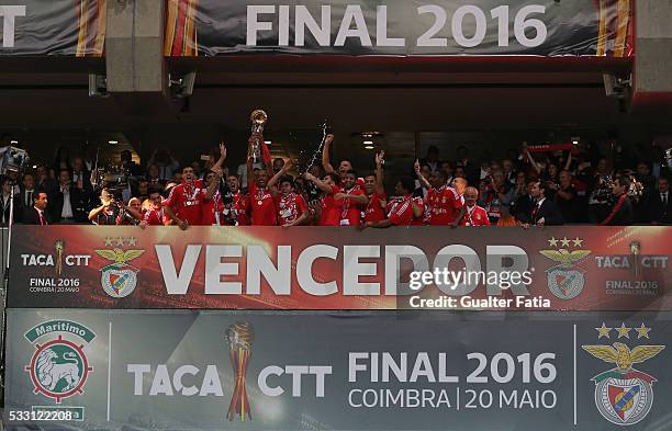 Benfica's defender from Brazil Luisao and teammates celebrate with trophy after winning the Portuguese League Cup Title at the end of the Taca CTT...