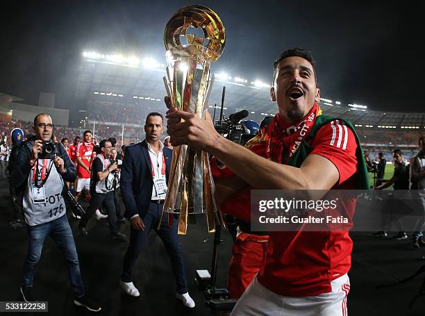 Benfica's defender Andre Almeida celebrates with trophy after winning the Portuguese League Cup Title at the end of the Taca CTT Final match between...