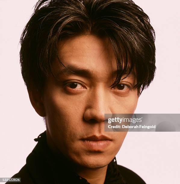 Deborah Feingold/Corbis via Getty Images) Japanese composer and actor Ryuichi Sakamoto poses for a portrait in 1988 in New York City, New York.