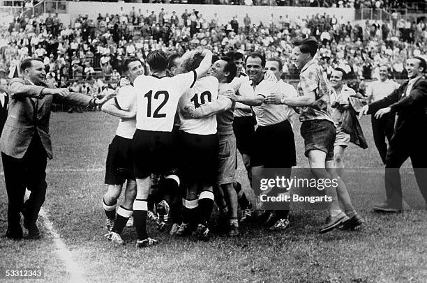 The German Team celebrate after they won the FIFA World Cup 1954 final match between Hungary and Germany on July 4, 1954 in Bern, Switzerland.