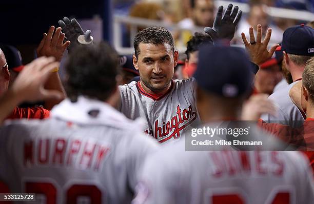 Ryan Zimmerman of the Washington Nationals is congratulated after hitting a solo home run in the second inning during a game against the Miami...