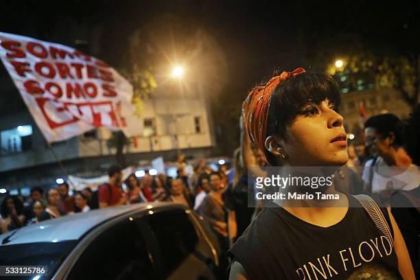 Protesters walk at a march against interim President Michel Temer on May 20, 2016 in Rio de Janeiro, Brazil. Temer assumed the position last week...