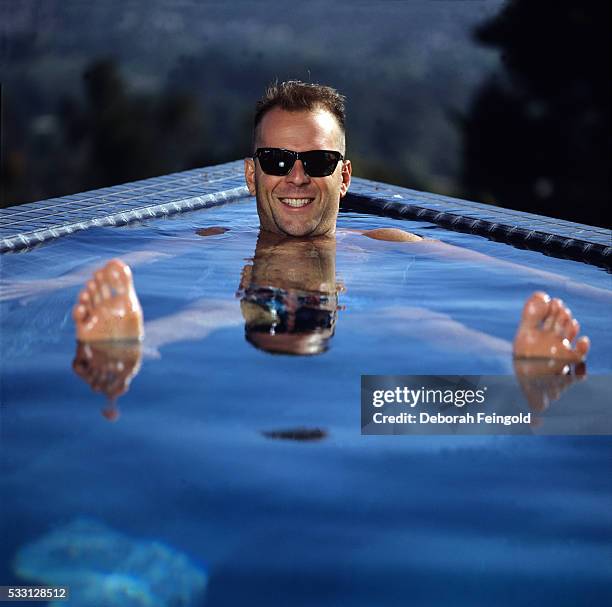 Deborah Feingold/Corbis via Getty Images) Bruce Willis in a Swimming Pool