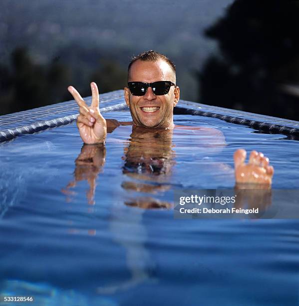 Deborah Feingold/Corbis via Getty Images) Bruce Willis in a Swimming Pool