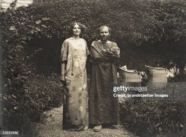 Gustav Klimt and Emilie Floege in a dress with floral pattern in the garden of the Oleander villa in Kammer at the Attersee lake. Photography, 1910....