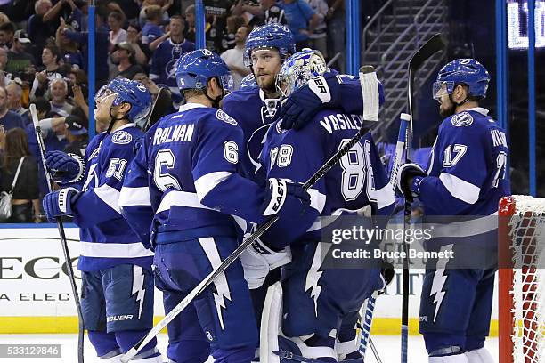 Victor Hedman of the Tampa Bay Lightning celebrates with Andrei Vasilevskiy after defeating the Pittsburgh Penguins in Game Four of the Eastern...