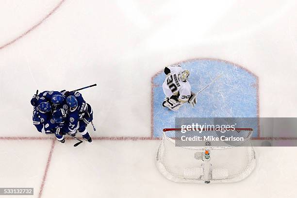 Tyler Johnson of the Tampa Bay Lightning celebrates with his teammates after scoring a goal against Matt Murray of the Pittsburgh Penguins during the...