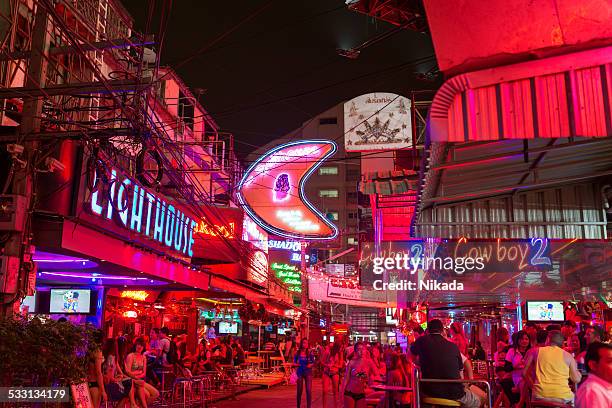 red light district soi cowboy in bangkok - go go dancer stock pictures, royalty-free photos & images