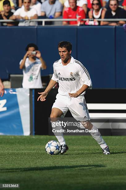 Michael Owen of Real Madrid dribbles the ball against Chivas De Guadalajara during a friendly on July 16, 2005 at Soldier Field in Chicago, Illinois....