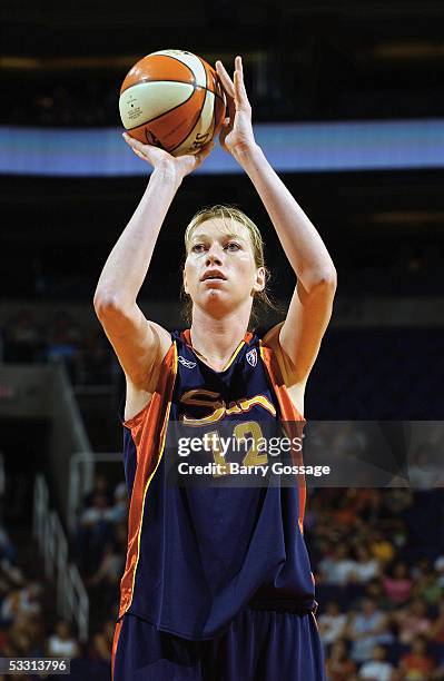 Margo Dydek of the Connecticut Sun shoots a free throw against the Phoenix Mercury during a WNBA game played on June 25, 2005 at America West Arena...