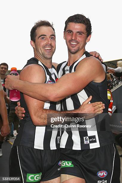 Steele Sidebottom and Scott Pendlebury of the Magpies celebrates winning the round nine AFL match between the Collingwood Magpies and the Carlton...
