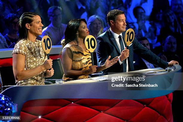 Jurors Jorge Gonzalez, Motsi Mabuse and Joachim Llambi show the 10-points-sign during the 10th show of the television competition 'Let's Dance' at...