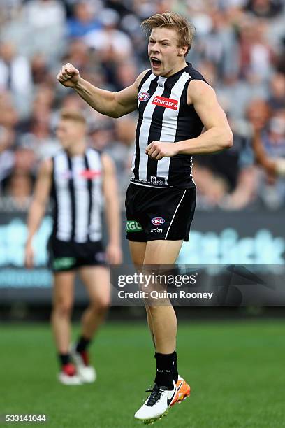 Jordan de Goey of the Magpies celebrates after kicking a goal during the round nine AFL match between the Collingwood Magpies and the Carlton Blues...