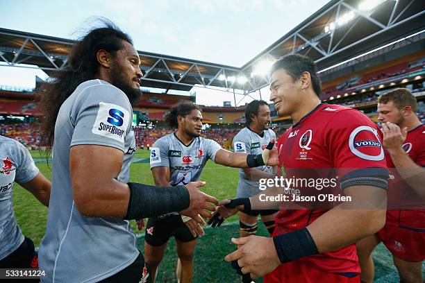Ayumu Goromaru of the reds shakes hands with Liaki Moli during the round 13 Super Rugby match between the Reds and the Sunwolves at Suncorp Stadium...