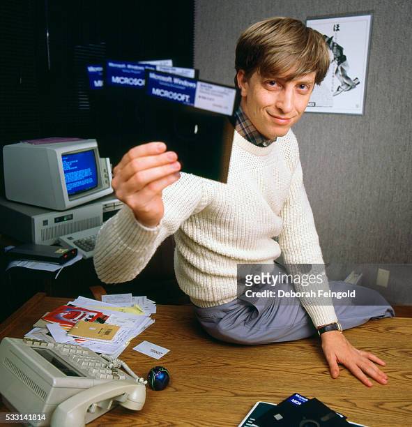 Deborah Feingold/Corbis via Getty Images) Bill Gates, CEO of Microsoft, holds a Windows 1.0 floppy discs soon after its release.