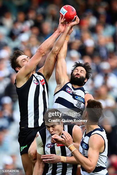 Darcy Moore of the Magpies and Jimmy Bartel of the Cats compete for a mark during the round nine AFL match between the Collingwood Magpies and the...