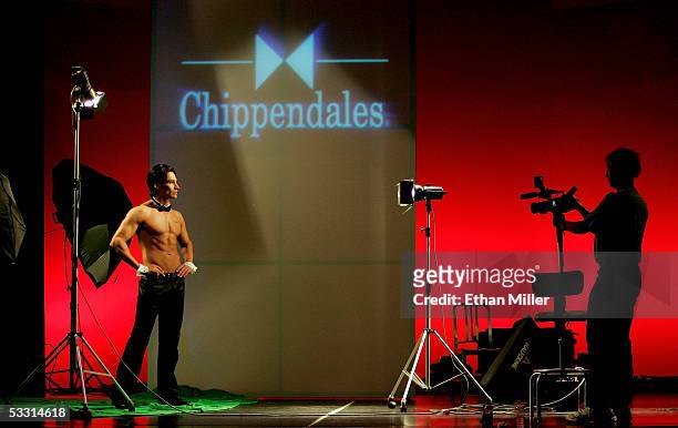 Chippendales dancer Juan DeAngelo of California is filmed by lighting assistant Curt Huettner of California at the Rio Hotel & Casino during the...