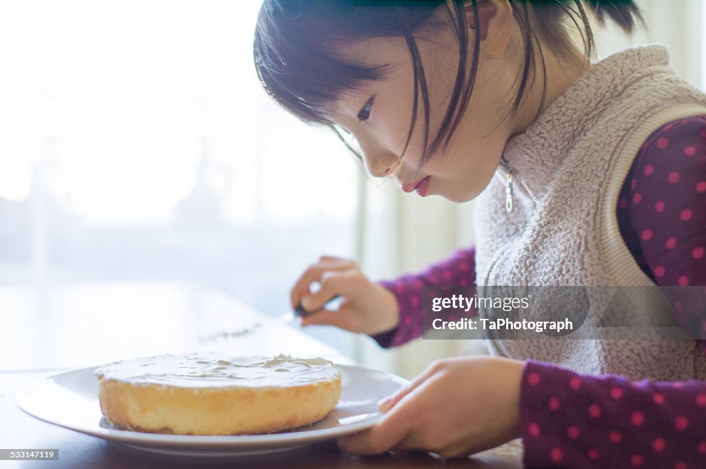 Girl making a cake