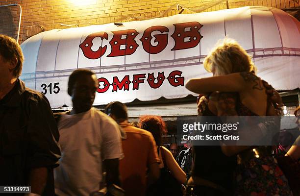 Fans gather outside following a press conference to announce an effort to save legendary punk club CBGB's on the first day of the last month of...