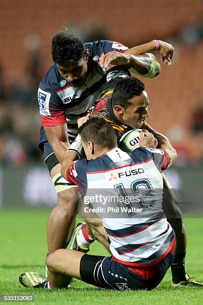 Toni Pulu of the Chiefs is tackled by Mitch Inman of the Rebels during the round 13 Super Rugby match between the Chiefs and the Rebels at FMG...