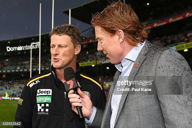 Tigers head coach Damien Hardwick talks with commentator Cameron Ling before the round nine AFL match between the Fremantle Dockers and the Richmond...