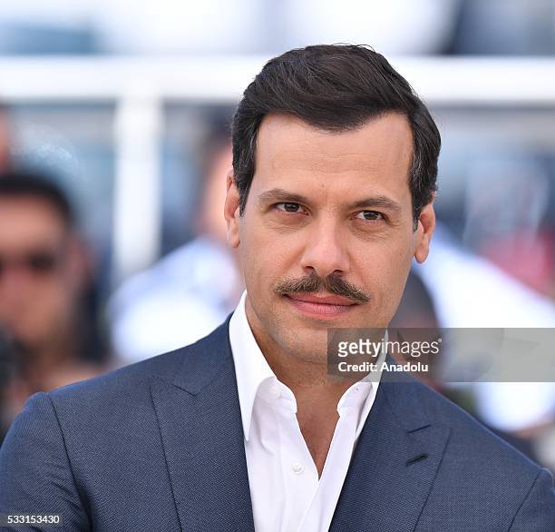 French actor Laurent Lafitte poses during the photocall for the film 'Elle' at the 69th international film festival in Cannes on May 21, 2016.