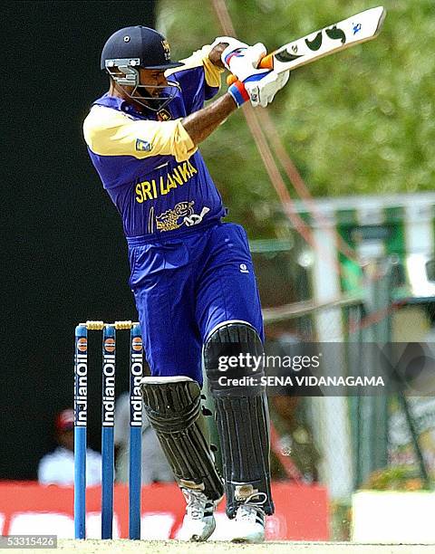 Sri Lankan cricket team captain Marvan Atapattu plays a stroke during a triangular one-day cricket series match between Sri Lanka and the West...