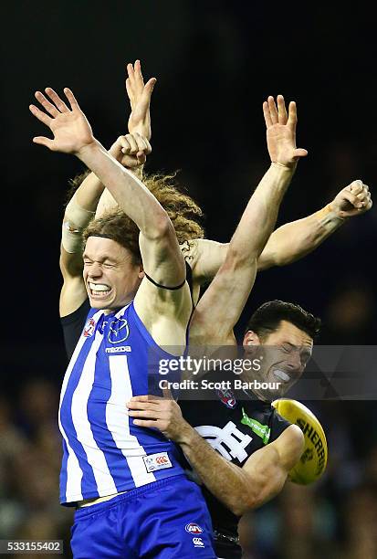 Ben Brown of the Kangaroos and Simon White of the Blues compete for the ball during the round nine AFL match between the North Melbourne Kangaroos...