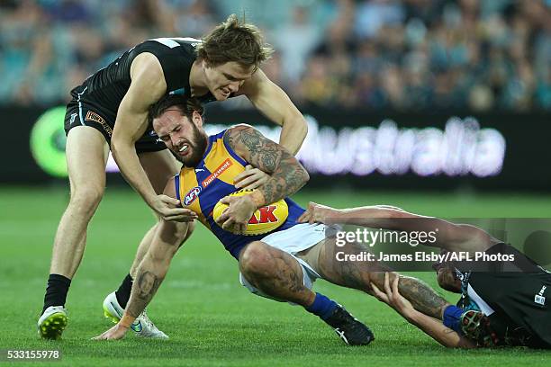 Chris Masten of the Eagles is tackled by Jared Polec and Brad Ebert of the Power during the 2016 AFL Round 09 match between Port Adelaide Power and...