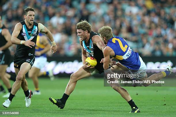Brad Ebert of the Power is tackled by Mark LeCras of the Eagles during the 2016 AFL Round 09 match between Port Adelaide Power and the West Coast...