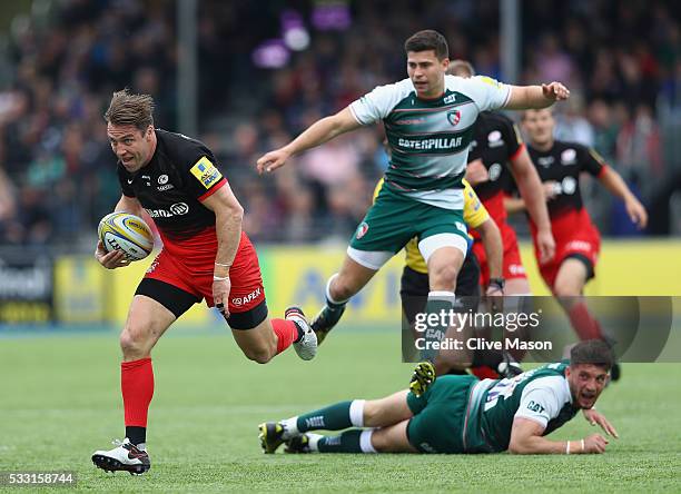 Chris Wyles of Saracens breaks through to score a try during the Aviva Premiership semi final match between Saracens and Leicester Tigers at Allianz...