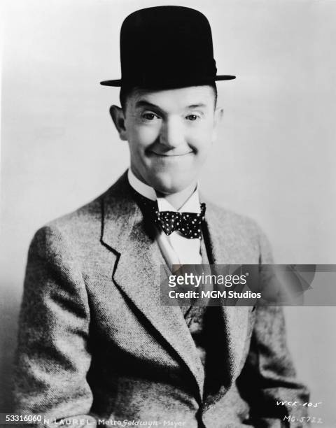 Studio portrait of British-born comic actor Stan Laurel , dressed in his usual bowler hat and suit, 1930s.