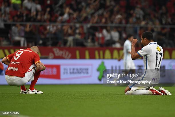 Bueno of Kashima Antlers celebrates the win while Simovic of Nagoya Grampus shows his dejection as they lose during the J.League match between Nagoya...