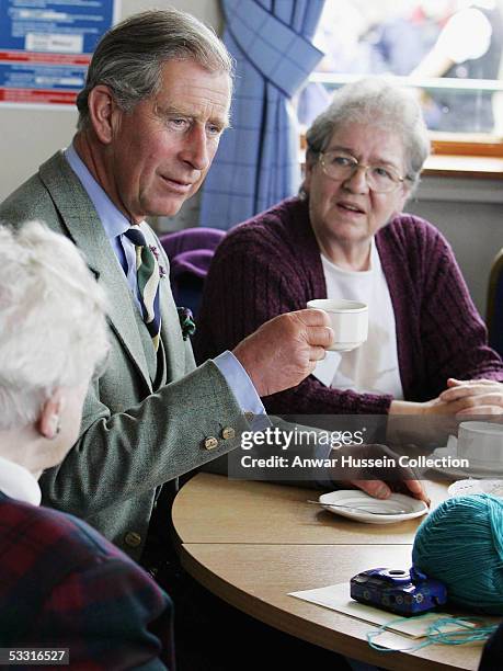 Prince Charles, the Duke of Rothesay, chats with locals at Old Men's Rest community centre, on August 1, 2005 in Wick, Scotland. The Prince, who...