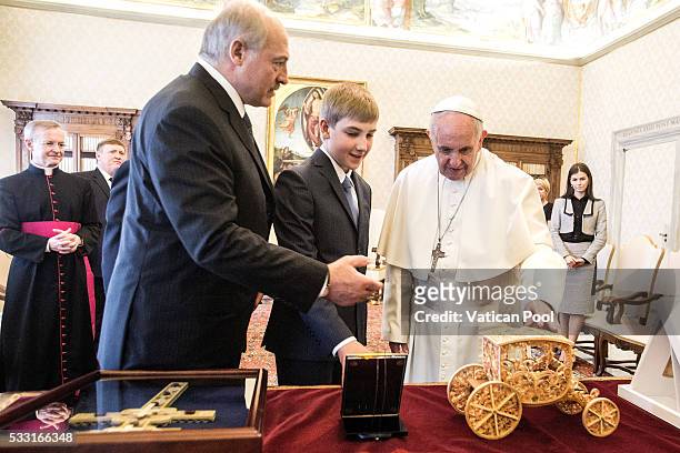 Pope Francis exchanges gifts with President of Belarus Alexander Lukashenko and his son Nikolai Lukashenko during a private audience at the Apostolic...