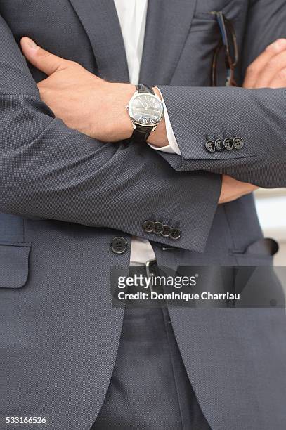 Laurent Lafitte, watch detail, attends the "Elle" Photocall during the 69th annual Cannes Film Festival at the Palais des Festivals on May 21, 2016...