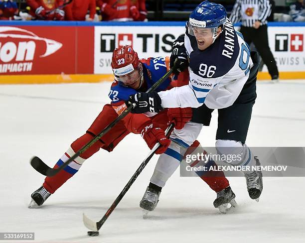 Russia's forward Roman Lyubimov vies with Finland's forward Mikko Rantanen during the semifinal game Finland vs Russia at the 2016 IIHF Ice Hockey...