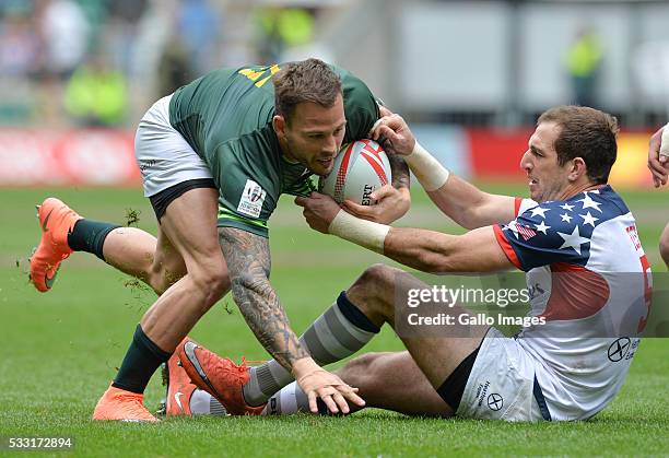 Francois Hougaard of South Africa is tackled by Zack Test of the USA during the match between South Africa and the United States of America on day 1...