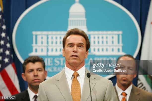 California Governor Arnold Schwarzenegger speaks during a news conference as California State Senators Abel Maldonado and Dean Florez look on at the...