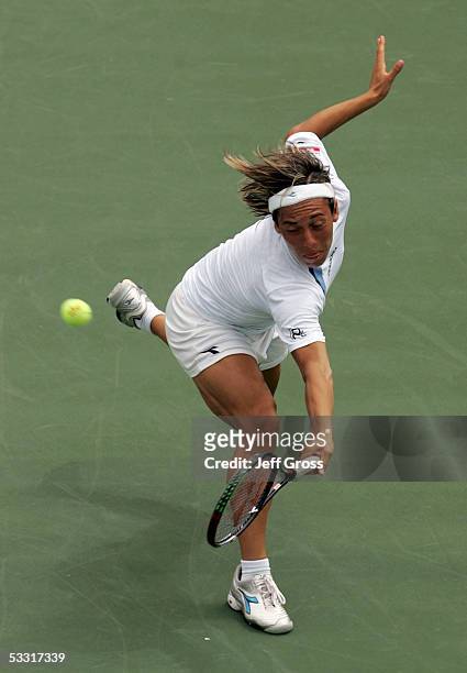 Francesca Schiavone of Italy lunges to return a backhand to Abigail Spears of the USA during the Acura Classic at the La Costa Resort and Spa on...