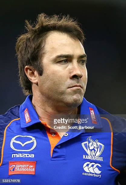 Brad Scott, coach of the Kangaroos speaks to his team during a quarter time break during the round nine AFL match between the North Melbourne...