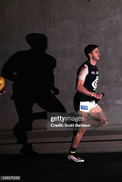 Marc Murphy of the Blues leaves the changing rooms and runs out onto the field during the round nine AFL match between the North Melbourne Kangaroos...