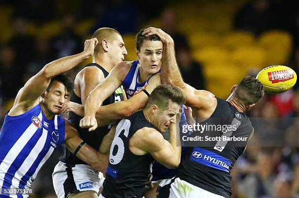 Liam Jones, Matthew Wright and Andrew Walker of the Blues along with Robbie Tarrant and Scott Thompson of the Kangaroos compete for the ball during...