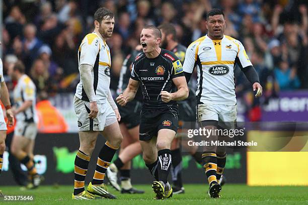 Gareth Steenson of Exeter Chiefs celebrates his sides second try as Elliot Daly and Charles Piutau of Wasps look on during the Aviva Premiership semi...