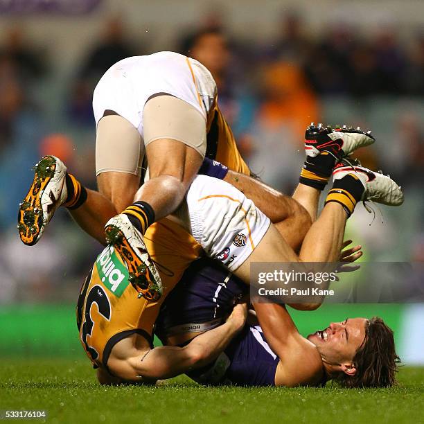 Lachlan Weller of the Dockers gets tackled by Steven Morris and Alex Rance of the Tigers during the round nine AFL match between the Fremantle...