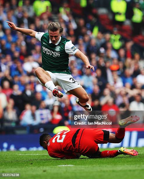 Jason Cummings of Hibernian vies with Wes Foderingham of Rangers during the Scottish Cup Final between Rangers and Hibernian at Hampden Park on May...